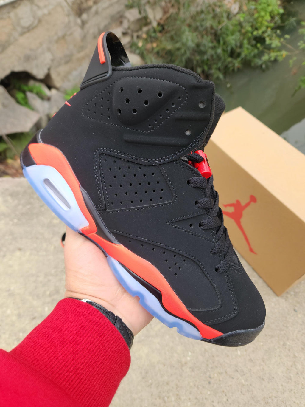 Air Jordan 6 – Black & Bright Red with Blue Sole Accents